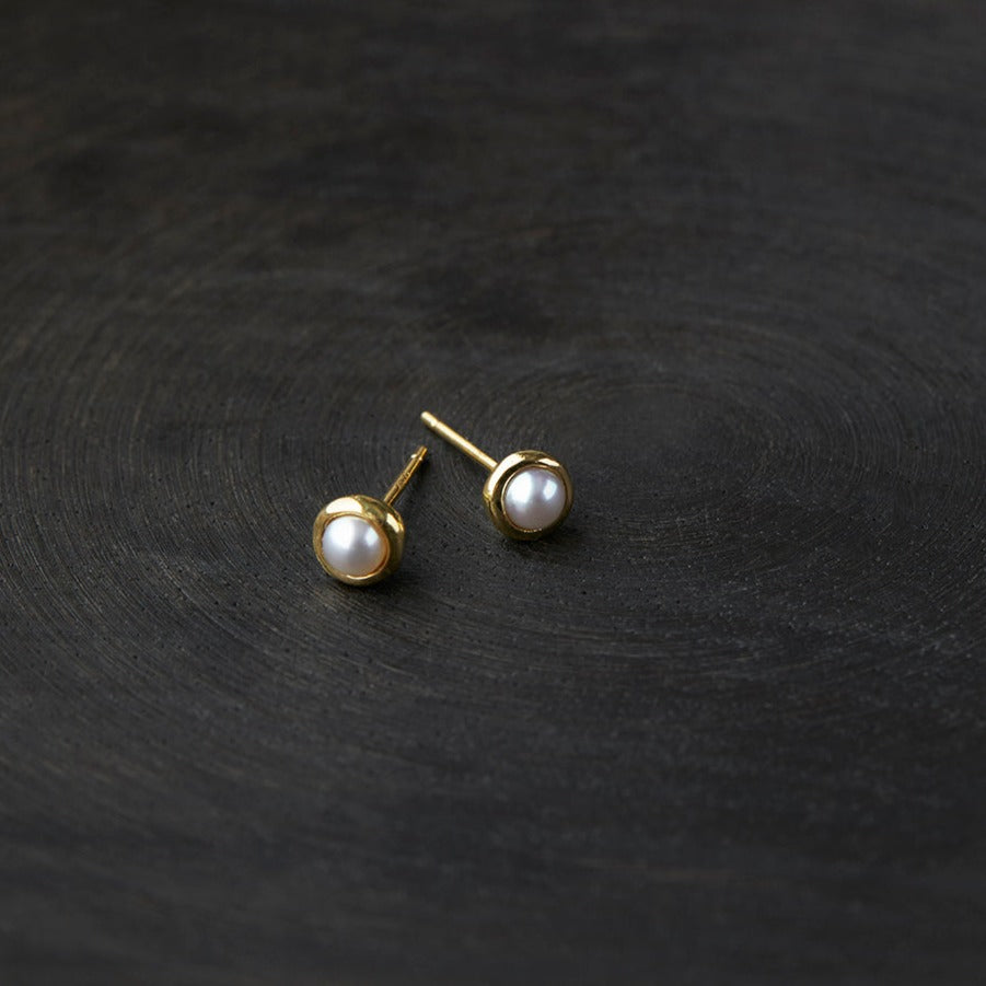 Gold Trimmed Pearl Studs